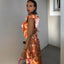 Woman wearing a colorful dress with a blurred background