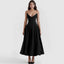 Woman wearing a black strapless dress on a white background