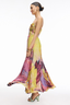 Woman wearing a colorful dress with a white background