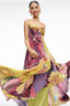 Woman wearing a colorful floral dress on a white background
